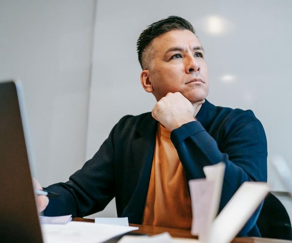Man in a state of deep focus after a workout, looking determined and calm.